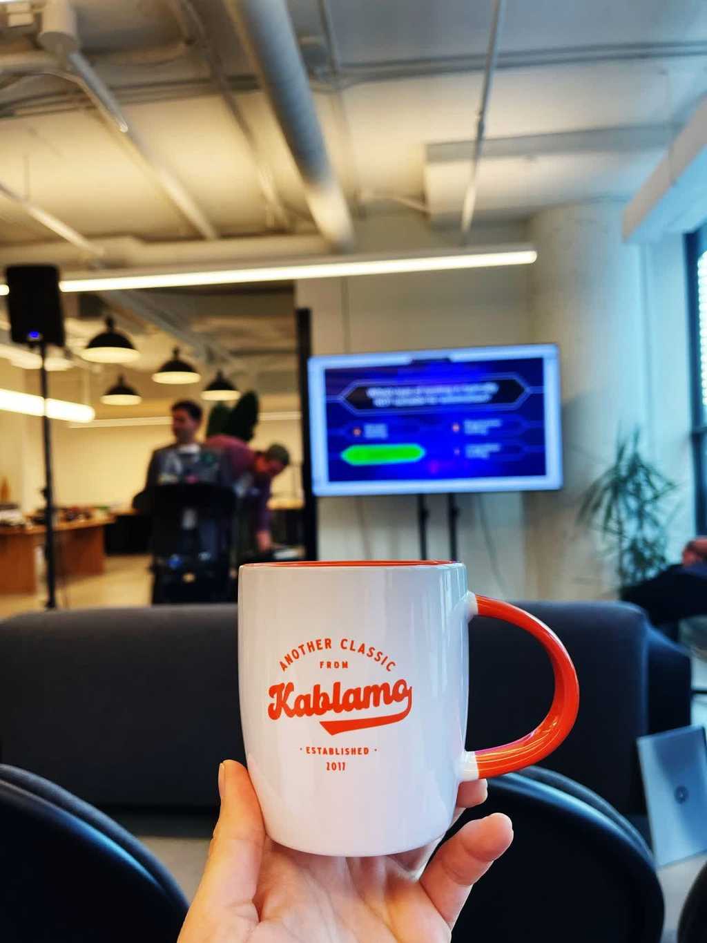 Image showing kablamo coffee mug given to a attendee as a prize for answering a quiz correctly